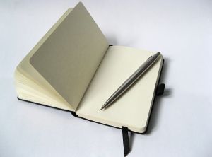 1176000_black_notebook_with_pencil